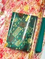 Пленка прозрачная двухцветная Новогодние марки красный/золото 70см*200гр ± 5%