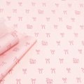 Бумага тишью на втулке Бантики розовый на светло-розовом 58см*15м±5% 30гр
