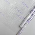 Пленка прозрачная двухцветная с рисунком Газета бело-сиреневая 70см*10ярд ± 5%